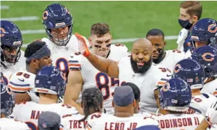  ?? TYLER KAUFMAN/AP ?? Hicks (holding court with teammates before the Bears’ playoff game in January) played well Sunday night against the Rams even as the defense around him mostly sputtered.