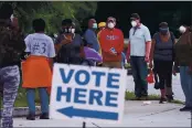  ?? BEN GRAY — ATLANTA JOURNAL-CONSTITUTI­ON ?? People wait in line to vote in Decatur, Ga., Monday.