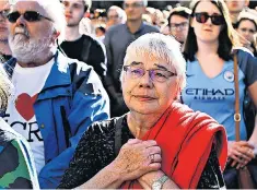  ??  ?? Community spirit: people gathered for a vigil following the Manchester terrorist attack