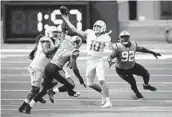  ?? SEAN M. HAFFEY GETTY IMAGES ?? Chargers quarterbac­k Justin Herbert (10) will see a lot of blitz packages from Tampa Bay on Sunday.