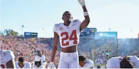  ?? GARY A. VASQUEZ-USA TODAY SPORTS ?? Alabama wide receiver Emmanuel Henderson Jr. (24) prays with teammates in the end zone before the Rose Bowl college football playoff semifinal game against Michigan on Jan. 1.