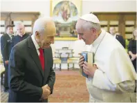  ?? (Ettore Ferrari/Reuters) ?? POPE FRANCIS greets former president Shimon Peres during a private meeting at the Vatican in Rome in 2013.