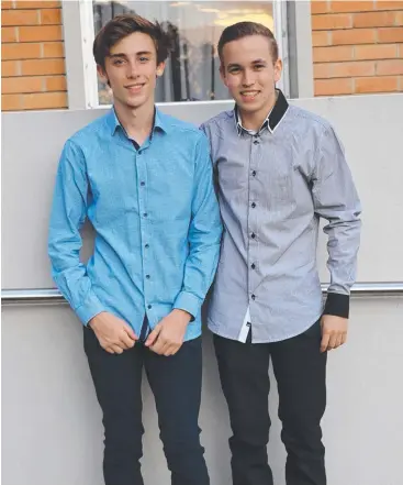  ??  ?? CLASSY DUO: Lachlan Doyle and Dean Ramsay from St Augustine’s College attended the University of Queensland’s Young Scholars Program.