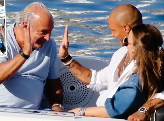  ??  ?? Family holiday: With one arm wrapped around Chloe, Jeremy Meeks high-fives Sir Philip Green on a superyacht in Greece