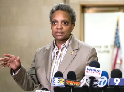  ?? SUN-TIMES FILE PHOTO ?? Mayor-elect Lori Lightfoot speaks to reporters at City Hall the day after winning the runoff election.