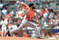  ?? Scot Tucker/Associated Press ?? ■ Houston Astros pitcher Dallas Keuchel throws to a San Francisco Giants batter during the first inning of a baseball game Tuesday in San Francisco.