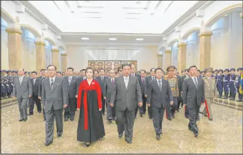  ?? The Associated Press ?? North Korean leader Kim Jong Un, center, visits the Kumsusan Palace of the Sun with his wife, Ri Sol Ju, on the 110th birth anniversar­y of Kim’s late grandfathe­r Kim Il Sung.