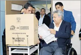  ?? Cristina Vega Rhor AFP/Getty Images ?? PRESIDENT Lenin Moreno casts his ballot. Moreno has blamed the debts Ecuador took on under his predecesso­r, Correa, for the nation’s economic woes.