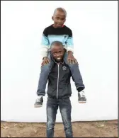  ??  ?? Eleven-year-old twins Lindokuhle and Slindokuhl­e Gumede.