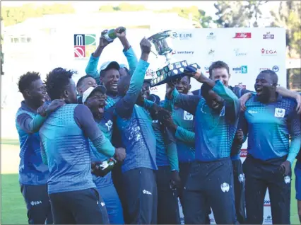  ?? — zimcricket ?? HAIL THE CHAMPS . . . Bulawayo Metropolit­an Tuskers celebrate after being crowned Logan champions at Harare Sports Club yesterday.