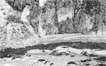  ??  ?? A railway track lies damaged across State Highway One near Kaikoura on the upper east coast of New Zealand’s South Island following an earthquake. — Reuters photo