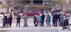  ?? CITY OF WAUKESHA/AFP VIA GETTY IMAGES ?? LEFT: This image taken from a Facebook livestream by the city of Waukesha shows a red SUV speeding through the holiday parade crowd in Waukesha on Sunday.