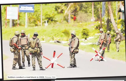  ?? Picture: FILE ?? Soldiers conduct a road block in 2006.