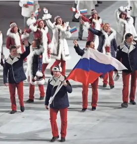  ??  ?? Alexandr Zubkov leads the Russian Federation team in the opening ceremony for the 2014 Olympic Winter Games in Sochi, Russia. ROBERT HANASHIRO/USA TODAY