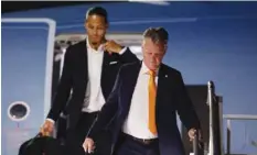  ?? (Reuters) ?? Netherland­s coach Louis van Gaal (right) and Virgil van Dijk arrive in Doha.