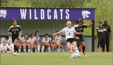  ?? Terrance Armstard/News-Times ?? Battle for the ball: El Dorado's Katie Carruth (5) battles Hot Springs' Arisbet Aragon (3) for the ball during the second half of their game Wednesday afternoon. The Lady Wildcats won 11-0.