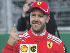  ?? AFP ?? Sebastian Vettel had reason to be happy with his efforts in Baku after securing pole position for today’s race