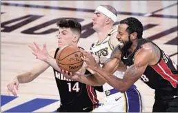  ?? Wally Skalij Los Angeles Times ?? LAKERS GUARD Alex Caruso, center, shown in October, is in protocols used for a positive or inconclusi­ve coronaviru­s test or for contact tracing reasons.