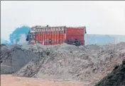  ?? SANJEEV KUMAR/HT ?? Illegal sand and gravel consignmen­ts being offloaded at the site where (below) district Congress vicepresid­ent KC Bawa supervises the arrival from Sidhwan Bet near Ludhiana, in an office in Budhlada town of Mansa district.