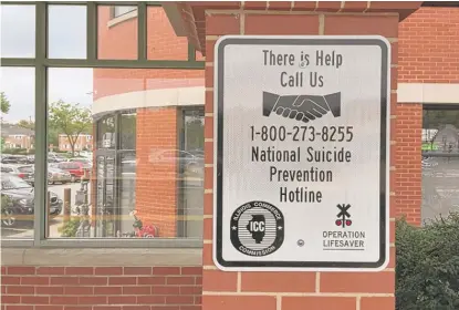  ?? NEIL STEINBERG/ SUN- TIMES ?? Trying to stem the tide of people taking their own lives, Metra began posting the phone number for the National Suicide Prevention Hotline: 1- 800- 273- 8255.