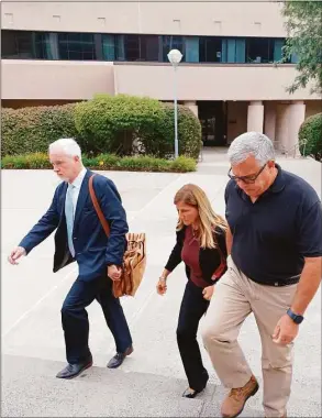  ?? Lisa Backus / Hearst Connecticu­t Media ?? Sherri Turner, center, who served as Plymouth Center School’s principal, arrives at state Superior Court in New Britain on Wednesday. Turner has been charged with failure to report the abuse, neglect or injury of a child or imminent risk of serious harm to a child. She allegedly failed to report the alleged sexual abuse perpetrate­d by fourth grade teacher James Eschert.