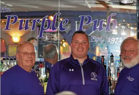  ?? PHOTOS BY NICHOLAS BUONANNO — NBUONANNO@TROYRECORD.COM ?? Pictured behind the bar at the Purple Pub Restaurant, from left, co-owner Bob Rentz, Manager Drew Rentz, and co-owner Greg Rentz. The pub is celebratin­g its 45th anniversar­y this weekend.
