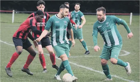  ?? PHOTO: MARTIN DAVIES ?? Blackstone­s’ player-managers Lee Clarke (right, green) and Daniel French in action in their United Counties Division One defeat at Raunds