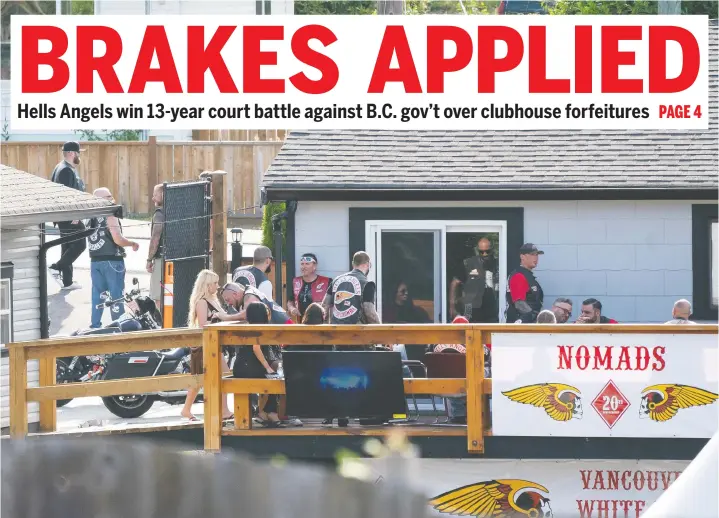  ?? — RICHARD LAM ?? Members and guests of the Hells Angels hang out on the back deck of their Nanaimo clubhouse on July, 21, 2018. Nanaimo’s was one of the targeted clubhouses.