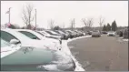  ?? Associated Press ?? The used vehicle lot at a LaFontaine auto dealership in Fenton Township, Mich., in January.