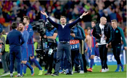  ??  ?? FC Barcelona coach Luis Enrique celebrates his team’s 6-1 win over Paris Saint-Germain in their Champions League Round of 16 second leg match at Camp Nou in Barcelona on Wednesday. Barcelona won 6-5 on aggregate to advance to the quarter-finals. —