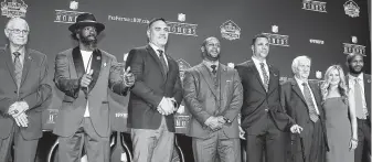  ?? Icon Sportswire / Icon Sportswire via Getty Images ?? The 2019 NFL Hall of Fame class includes, from left, Johnny Robinson, Ed Reed, Kevin Mawae, Ty Law, Tony Gonzalez, Gil Brandt, Brittany Bowlen (for Pat Bowlen) and Champ Bailey at the Fox Theatre in Atlanta.
