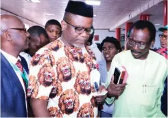  ??  ?? From left Organic Agric Asso President, Prof. Victor Olowe, Anambra state Agric Commission­er, Afam Mbanefo & Regional Agric. Director, Sir Nnamdi Ibezim at the 2017 National Organic Agricultur­e Business summit in Akwa, Anambra state