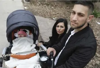  ?? RICHARD LAUTENS/TORONTO STAR ?? Gergo Balogh, right, faces indefinite separation this week from his wife, Nikoletta, and daughter, Nicole.