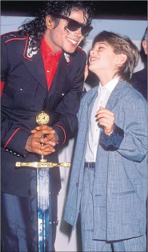  ??  ?? CLOSE: Jackson and James Safechuck at a party thrown in London in 1988