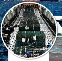  ?? ?? AID: Crates of missiles, above, on the C-17 used to carry Queen Elizabeth II’s coffin, right