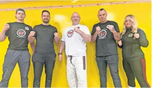  ?? ?? Initiative Gym owner Paul Garvie, middle, with instructor­s Eamon Cramb, Thomas Reguieg, Paul Garvie, Ricky Mcallister and Amber Shearer