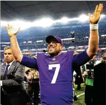  ?? JAMIE SQUIRE / GETTY IMAGES ?? Quarterbac­k Case Keenum and the Vikings are all smiles after his 61-yard scoring pass to Stefon Diggs on the final play defeats the Saints to earn a berth in the NFC title game.