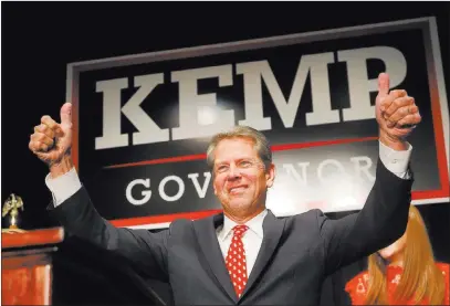  ?? John Bazemore ?? The Associated Press Georgia Republican gubernator­ial candidate Brian Kemp gives a thumbs-up to supporters Wednesday in Athens, Ga.