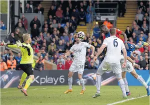  ??  ?? The form guy: Christian Benteke powers in a header from an Andros Townsend cross to score his third goal in four games for a resurgent Crystal Palace