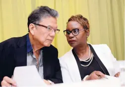  ??  ?? In this September 2017 Gleaner photo, Executive Chairman Lascelles Chin and Managing Director of Lasco Financial Services Jacinth HallTracey consult at the company’s annual general meeting.