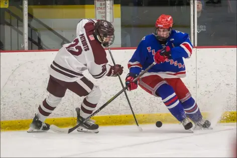  ?? JAMES THOMAS PHOTO ?? Tewksbury’s Cooper Robillard, right, plays strong defense against Concord-carlisle’s Jay Carter earlier this season. Tewksbury drew the top seed in Division 2.
