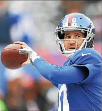  ?? JOHN BLAINE — DIGITAL FIRST MEDIA ?? Giants quarterbac­k Eli Manning warms up prior to last Sunday’s game against the Eagles at MetLife Stadium in East Rutherford.