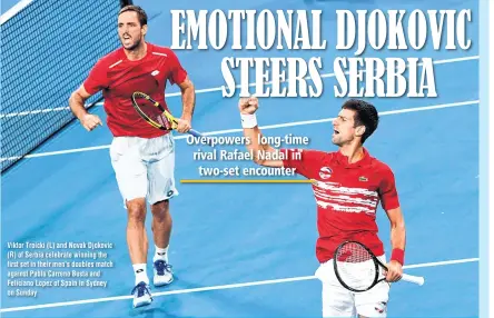  ??  ?? Viktor Troicki (L) and Novak Djokovic (R) of Serbia celebrate winning the first set in their men's doubles match against Pablo Carreno Busta and Feliciano Lopez of Spain in Sydney on Sunday