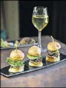  ?? CONTRIBUTE­D BY MIA YAKEL ?? Atlas Sliders with ground Wagyu, smoked gouda-pimento cheese, Tucker Farms green leaf, toasted brioche bun.