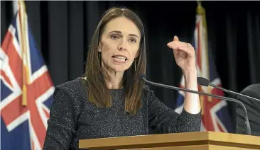  ??  ?? Jacinda Ardern announcing Level 4 restrictio­ns from tomorrow, which she says could last for four weeks. One letter-writers says the country needs to shut down for eight weeks at least.