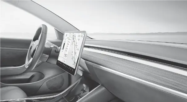  ?? PROVIDED BY TESLA ?? The Tesla Model 3’ s infotainme­nt screen replaces analog buttons with digital controls.