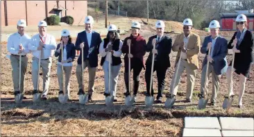 ?? Spencer Lahr / RN-T ?? Rome Board of Education members join administra­tors and a representa­tive of J&R Constructi­on & Developmen­t during a groundbrea­king ceremony for the new Main Elementary School on Friday.