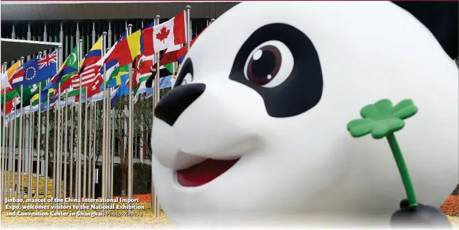  ?? Photo: Xinhua ?? Jinbao, mascot of the China Internatio­nal Import Expo, welcomes visitors to the National Exhibition and Convention Center in Shanghai.