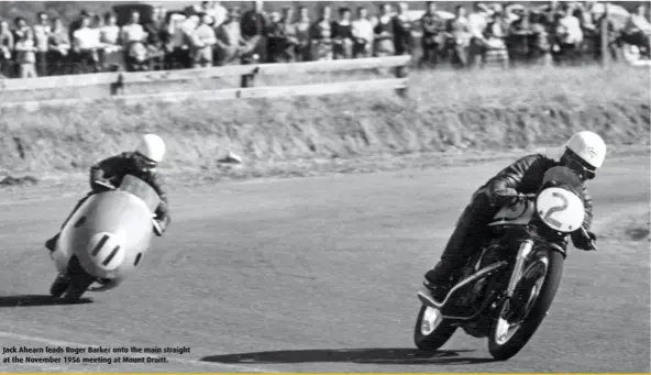  ??  ?? Jack Ahearn leads Roger Barker onto the main straight at the November 1956 meeting at Mount Druitt.