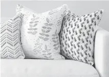  ??  ?? Reversible accent pillows are part of Richardson’s next textiles line.